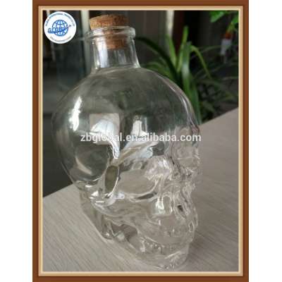 180ml Wholesale clear glass skull head bottle with cork for drinking